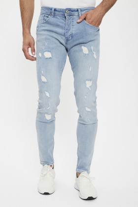 Jeans skinny effet déchiré bleu délavé homme